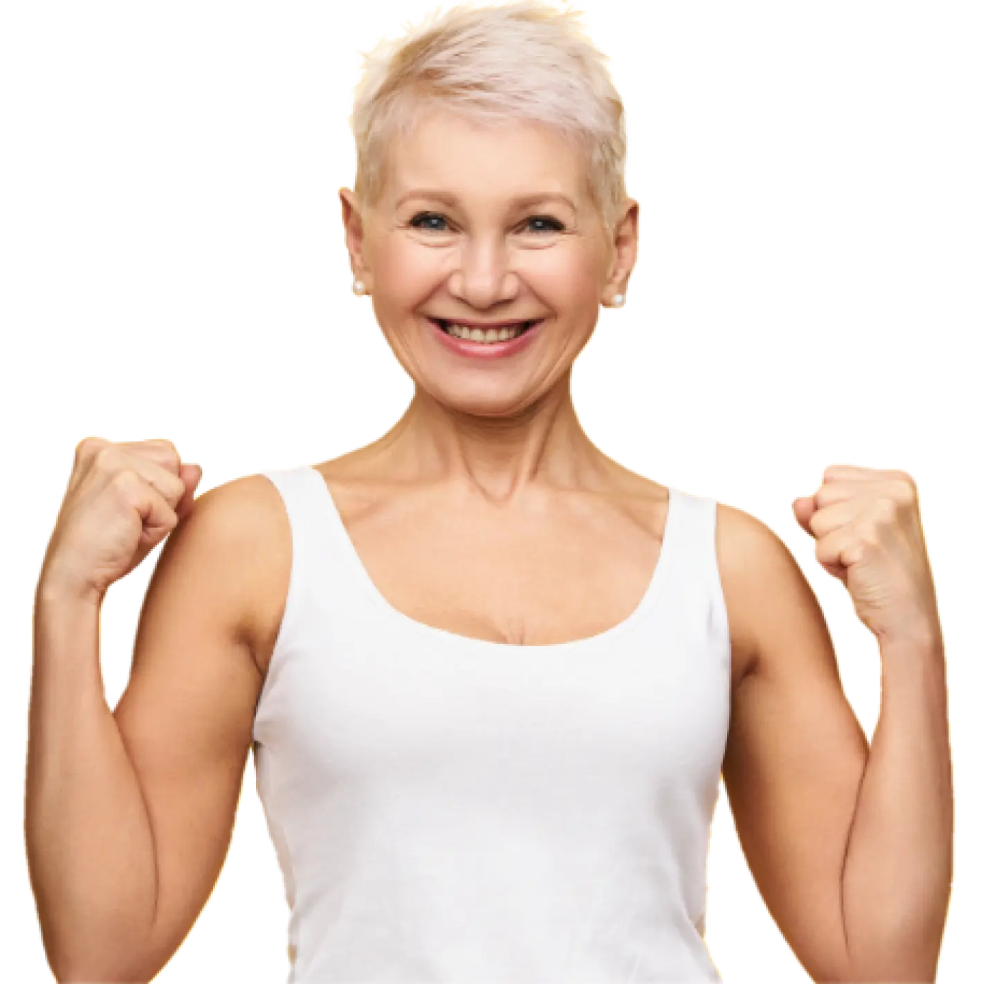 Fit elderly lady with short hair smiles brightly at the camera while holding her fists up in a victory pose